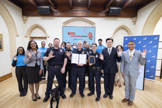The members of ASEZ and officers of the Middletown Police Department join together for the Anti-cyberbullying Forum